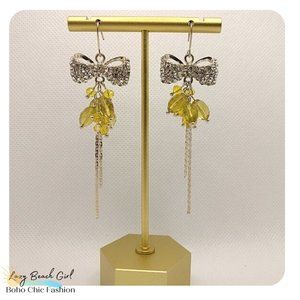 studded bow dangle earrings